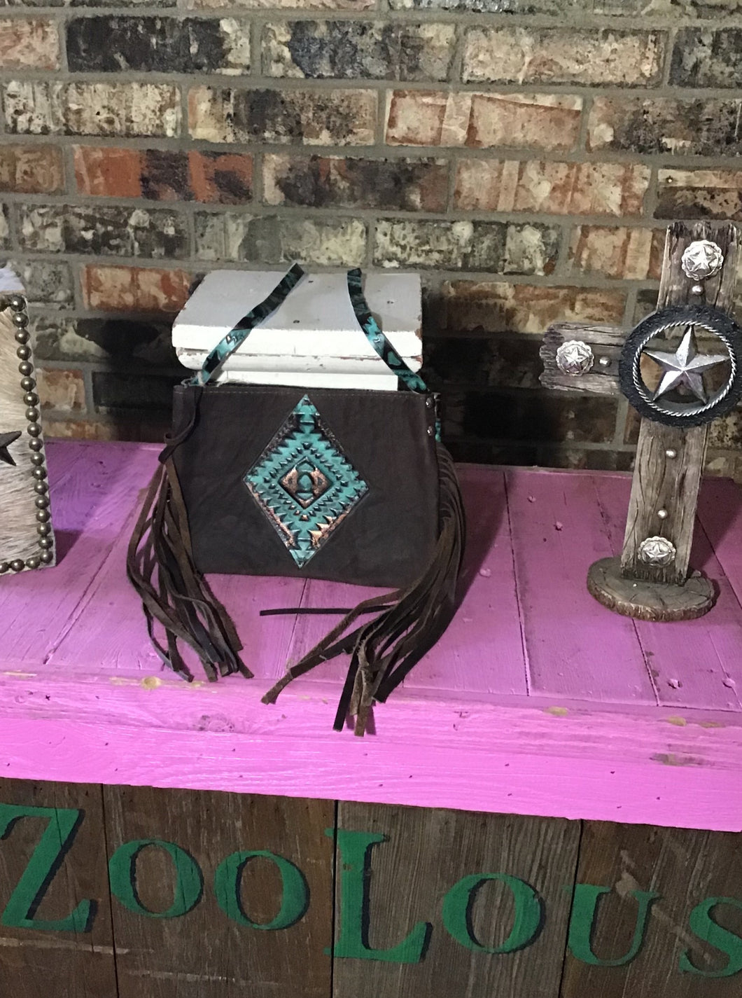 SMALL CROSS BODY PURSE brown leather front turquoise Aztec back 6’ tall 8.5’ wide inside is brown leather with 1 8’ wide 4’ tall pocket The strap is 25’ long half ‘ wide magnet closure